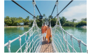 Guests enjoying a scenic walk across a bridge at Palawan Beach